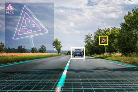 A simulation of how a computer vision program would identify cars and signage along the road